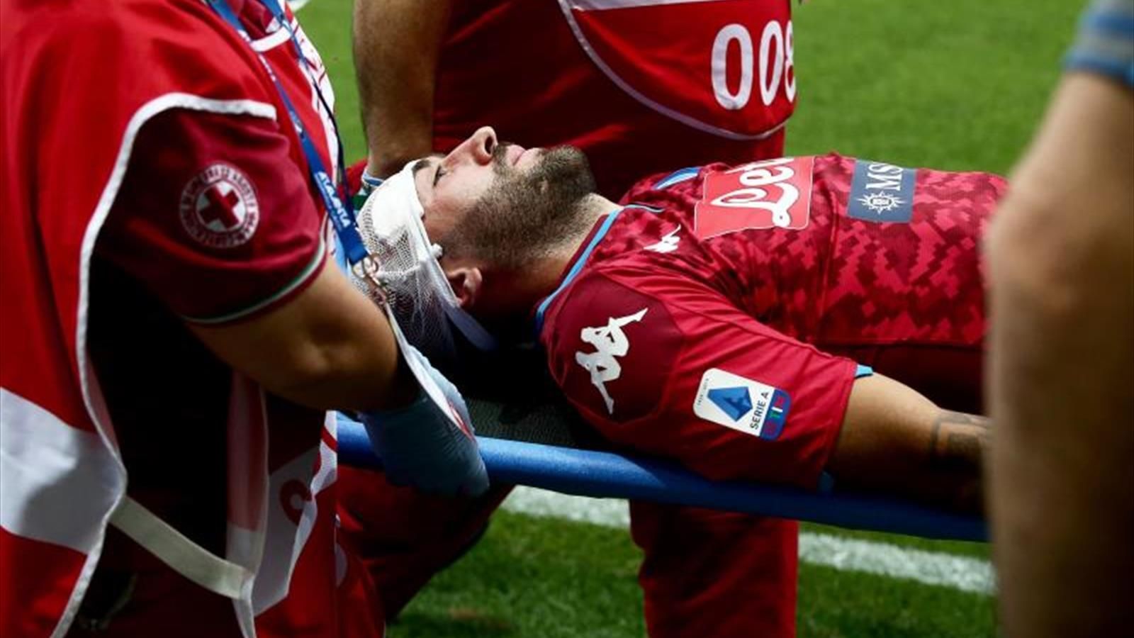 Ospina stretched out during Napoli 's defeat with blood running down his face  